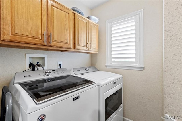 9885 E Lindale Ct, Inverness, FL 34450 - laundry area with washer and clothes dryer, cabinet space, and a textured wall