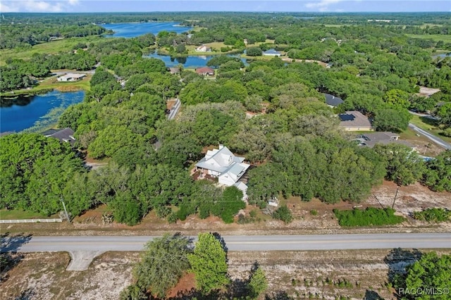 9885 E Lindale Ct, Inverness, FL 34450 - drone / aerial view of a nearby body of water and a heavily wooded area