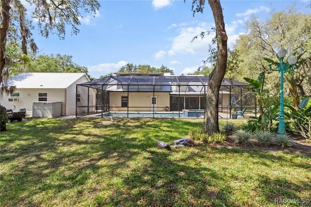 9885 E Lindale Ct, Inverness, FL 34450 - rear view of house featuring an outdoor pool, a lawn, and a lanai