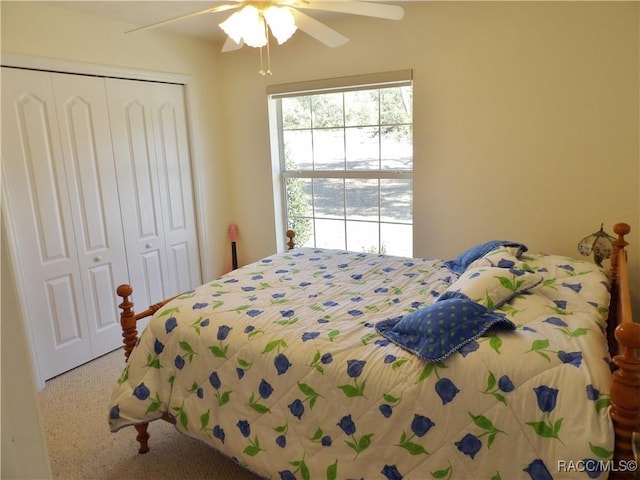 bedroom featuring carpet floors, a closet, and ceiling fan