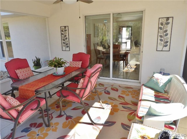 sunroom / solarium with ceiling fan