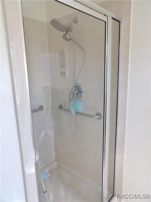 bathroom with an enclosed shower