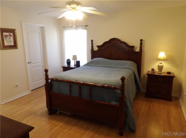 bedroom with light hardwood / wood-style flooring and ceiling fan