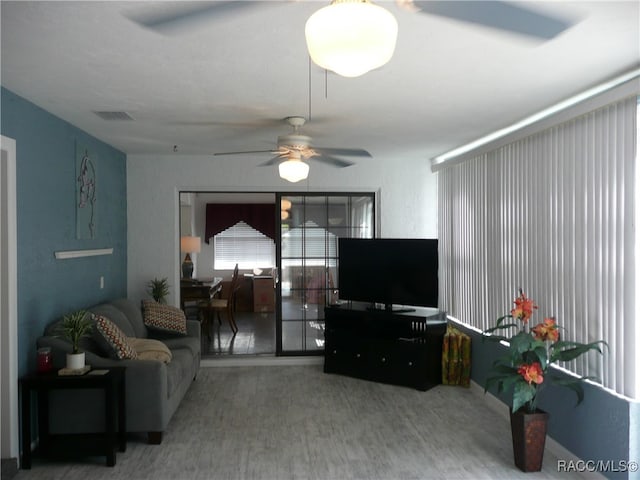 living room featuring ceiling fan