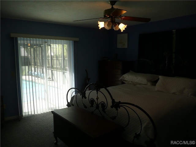 carpeted bedroom with ceiling fan and access to outside