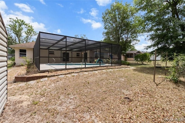 520 S Jefferson St, Beverly Hills, FL 34465 - back of house featuring glass enclosure and an outdoor pool