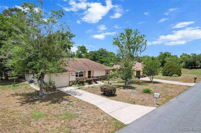 520 S Jefferson St, Beverly Hills, FL 34465 - view of front of home featuring a garage and concrete driveway