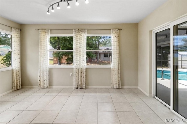 520 S Jefferson St, Beverly Hills, FL 34465 - interior space featuring baseboards, tile patterned floors, and a healthy amount of sunlight
