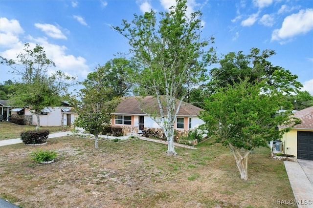 520 S Jefferson St, Beverly Hills, FL 34465 - view of front of property with a garage and stucco siding