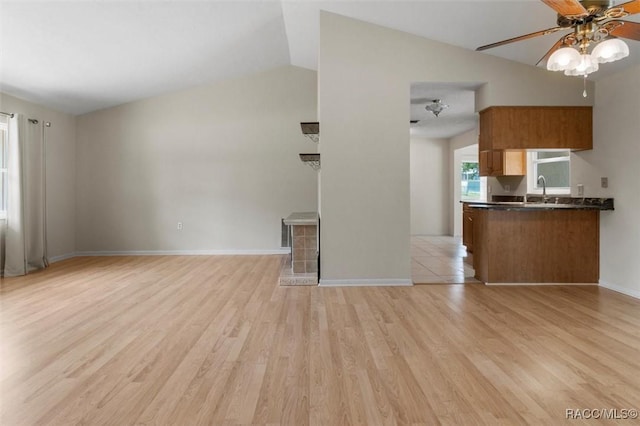 520 S Jefferson St, Beverly Hills, FL 34465 - unfurnished living room with ceiling fan, vaulted ceiling, baseboards, and light wood finished floors