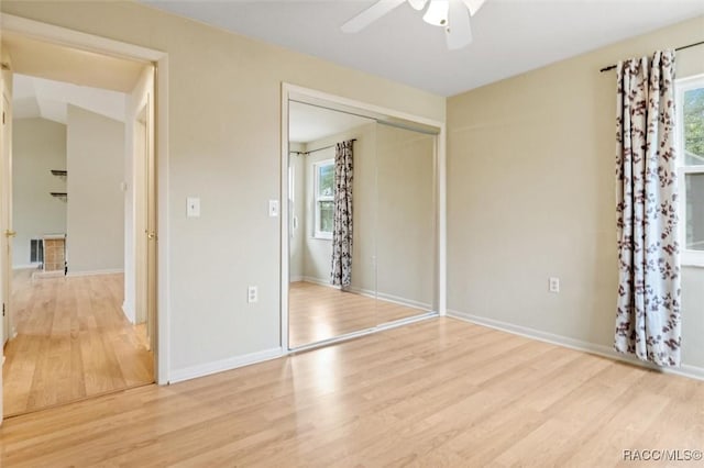 520 S Jefferson St, Beverly Hills, FL 34465 - unfurnished bedroom featuring baseboards, multiple windows, wood finished floors, and a closet