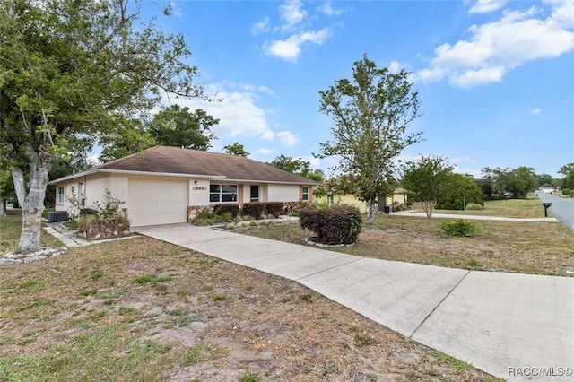 520 S Jefferson St, Beverly Hills, FL 34465 - ranch-style home with an attached garage, cooling unit, driveway, and stucco siding