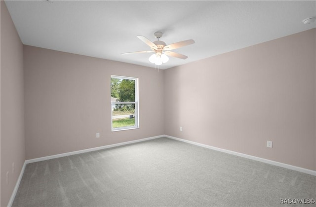 8880 N Circular Way, Citrus Springs, FL 34434 - carpeted spare room with a ceiling fan and baseboards