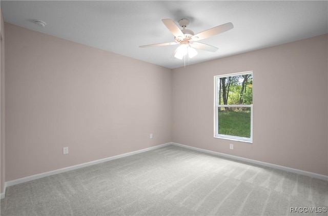 8880 N Circular Way, Citrus Springs, FL 34434 - empty room with light colored carpet, ceiling fan, and a smoke detector