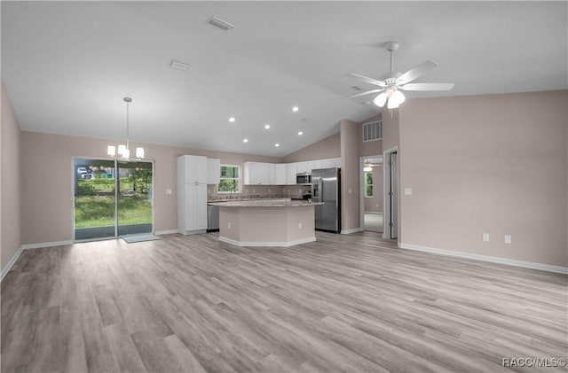8880 N Circular Way, Citrus Springs, FL 34434 - kitchen with stainless steel appliances, open floor plan, white cabinets, a center island, and a chandelier