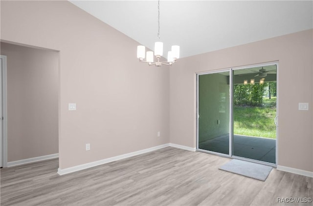 8880 N Circular Way, Citrus Springs, FL 34434 - unfurnished room with wood finished floors and a chandelier