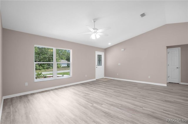 8880 N Circular Way, Citrus Springs, FL 34434 - empty room featuring lofted ceiling, a ceiling fan, and light wood-style floors