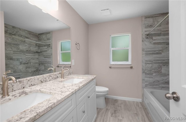 8880 N Circular Way, Citrus Springs, FL 34434 - bathroom with double vanity,  shower combination, marble look tiles, and healthy amount of natural light