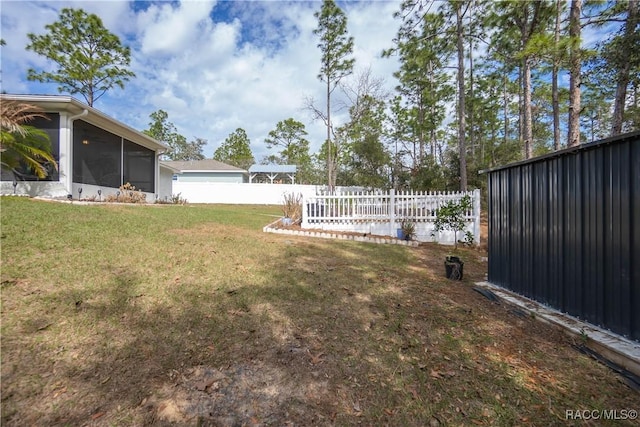 view of yard with a sunroom