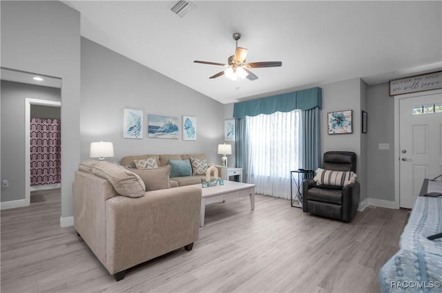 living room featuring light wood-type flooring, vaulted ceiling, and ceiling fan