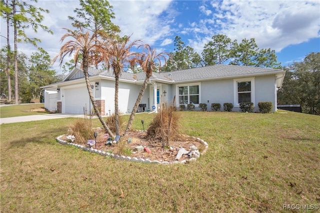 single story home with a garage and a front lawn