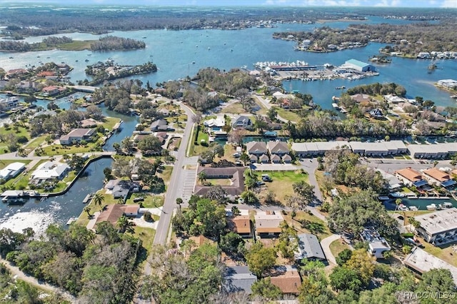 birds eye view of property with a water view and a residential view