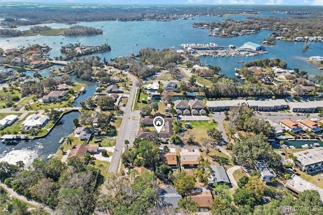 birds eye view of property featuring a residential view and a water view