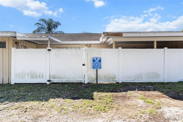 view of side of property featuring fence