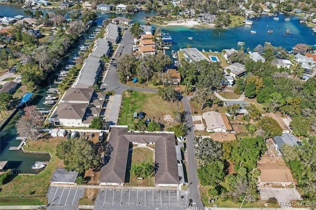 birds eye view of property with a water view and a residential view