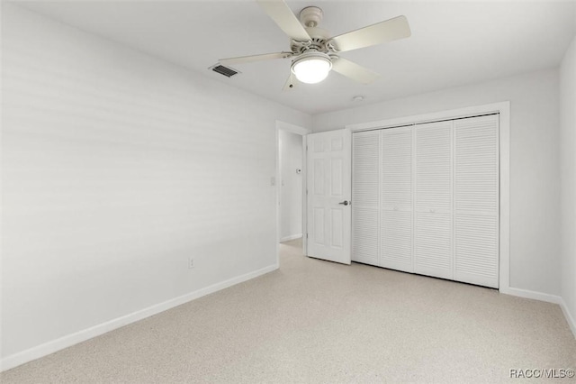 unfurnished bedroom featuring ceiling fan, a closet, visible vents, and baseboards