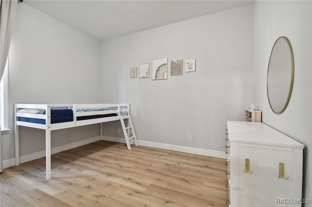 unfurnished bedroom featuring light wood-type flooring