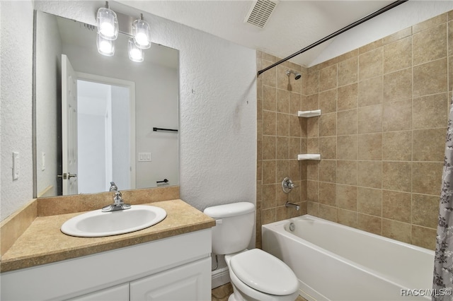 full bathroom with vanity, toilet, and shower / tub combo with curtain