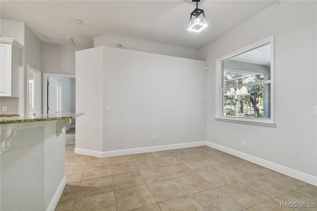 view of tiled spare room