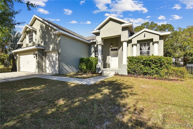 view of front of house with a garage and a front lawn