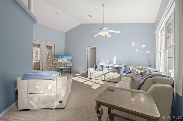 living area with a ceiling fan, baseboards, carpet floors, high vaulted ceiling, and french doors