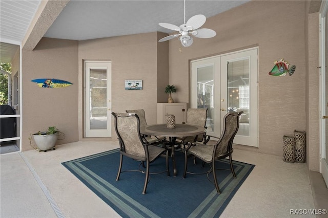 dining room with french doors and a ceiling fan