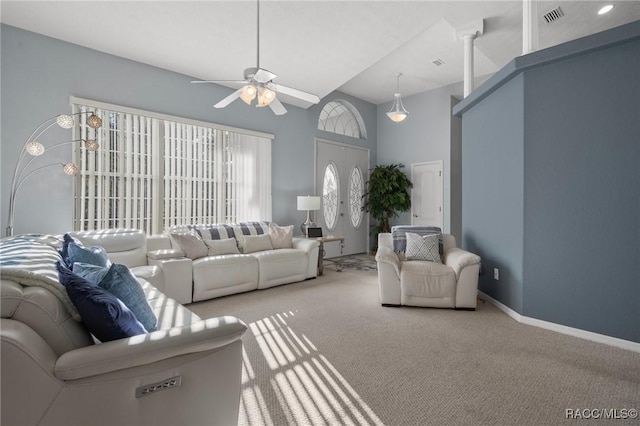 living area with carpet flooring, baseboards, visible vents, and ceiling fan