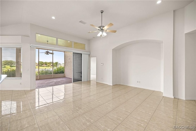 1328 W Diamond Shore Loop, Hernando, FL 34442 - empty room with ceiling fan, tile patterned flooring, recessed lighting, a towering ceiling, and arched walkways