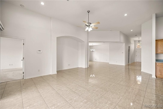 1328 W Diamond Shore Loop, Hernando, FL 34442 - spare room with ceiling fan, recessed lighting, light tile patterned floors, a chandelier, and a high ceiling