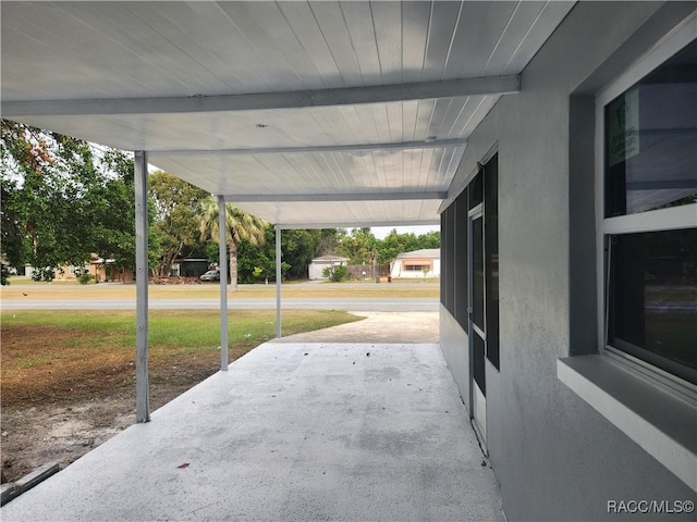 view of patio / terrace with a carport