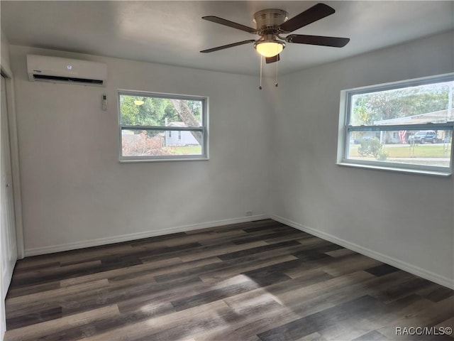 unfurnished room featuring a wall mounted air conditioner, dark hardwood / wood-style flooring, and ceiling fan