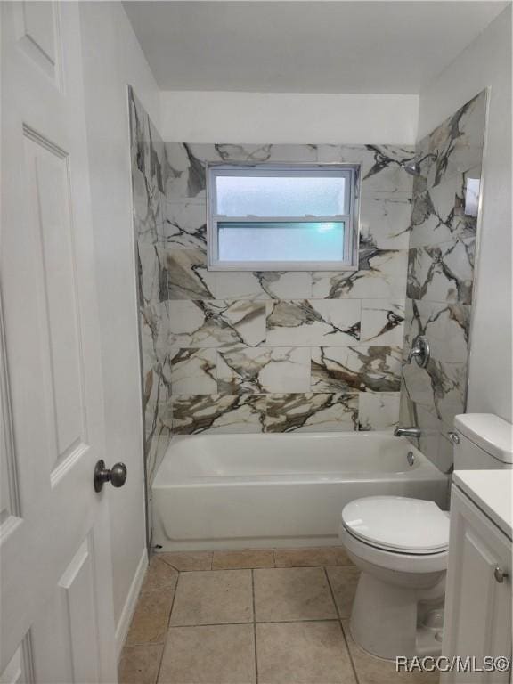 full bathroom featuring tile patterned floors, vanity, toilet, and tiled shower / bath