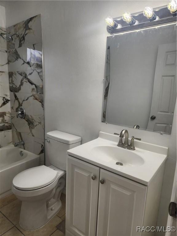 full bathroom featuring tile patterned flooring, vanity, tiled shower / bath combo, and toilet