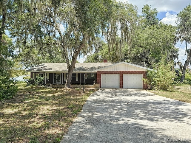 ranch-style house featuring a garage