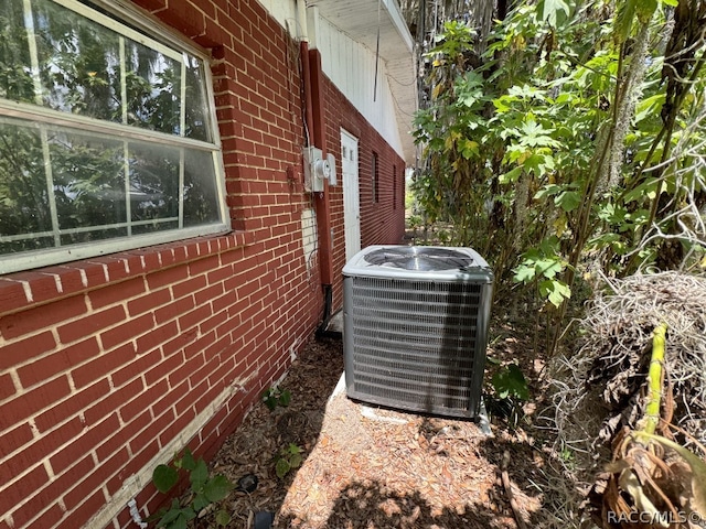 view of side of home featuring central air condition unit