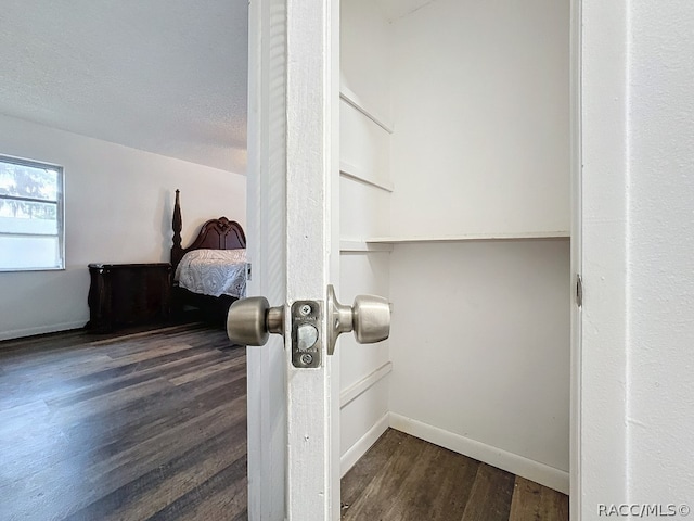 interior details featuring wood-type flooring and a textured ceiling