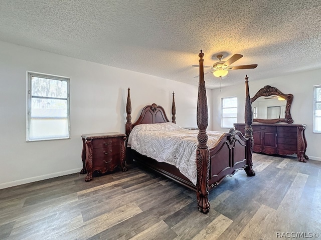 bedroom featuring hardwood / wood-style floors, ceiling fan, and a textured ceiling