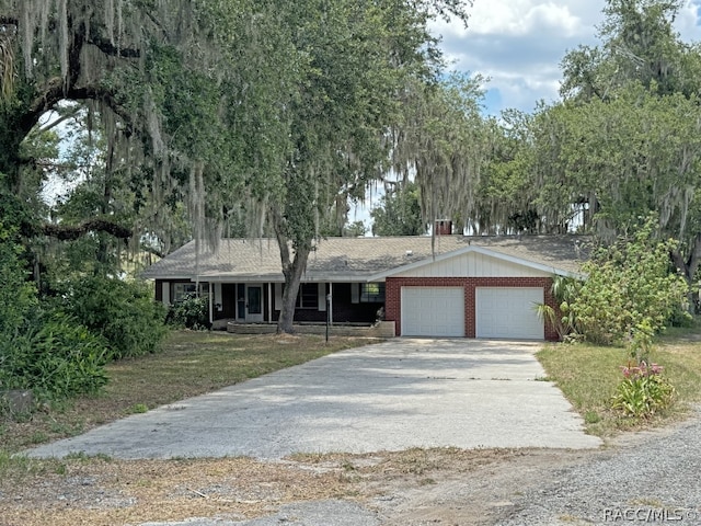 view of front of house with a garage and a front yard