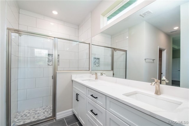 9276 N Alpinia Dr, Citrus Springs, FL 34434 - bathroom featuring a stall shower, double vanity, tile patterned flooring, recessed lighting, and baseboards