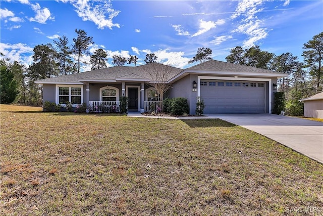 ranch-style house featuring a garage, a front yard, and a porch